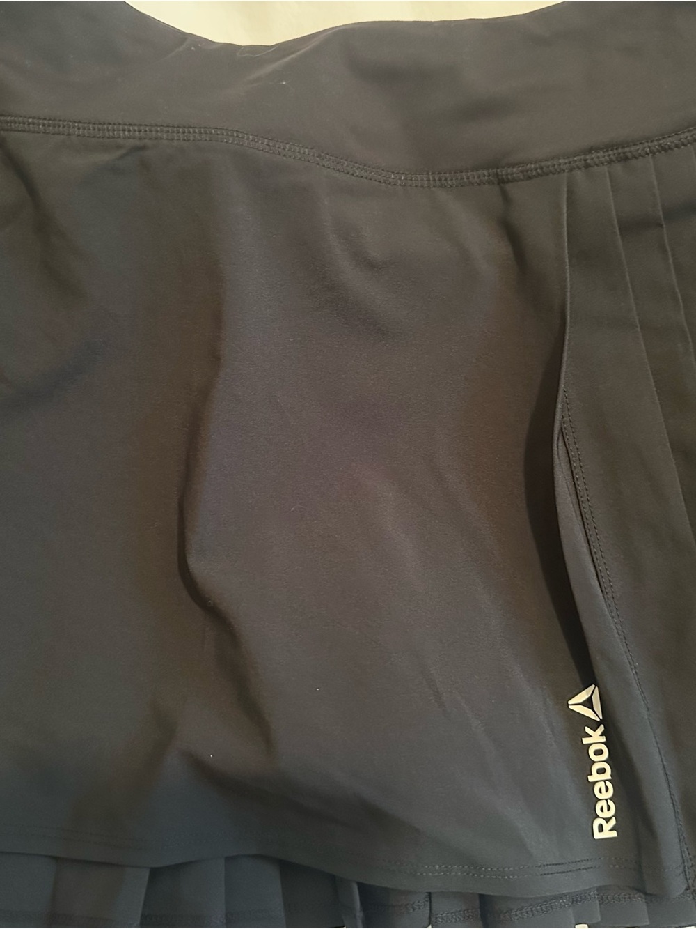 Reebok Black Activewear Golf Skort with flattering pleated back.
